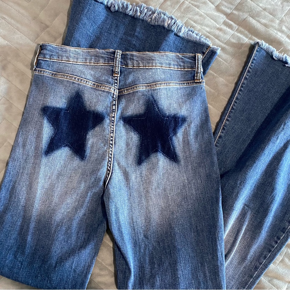 Sneak Peek Star Distressed Flare Jeans